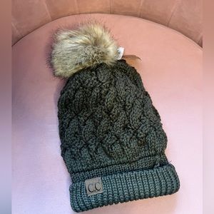 C.C olive green hat with fur pompom